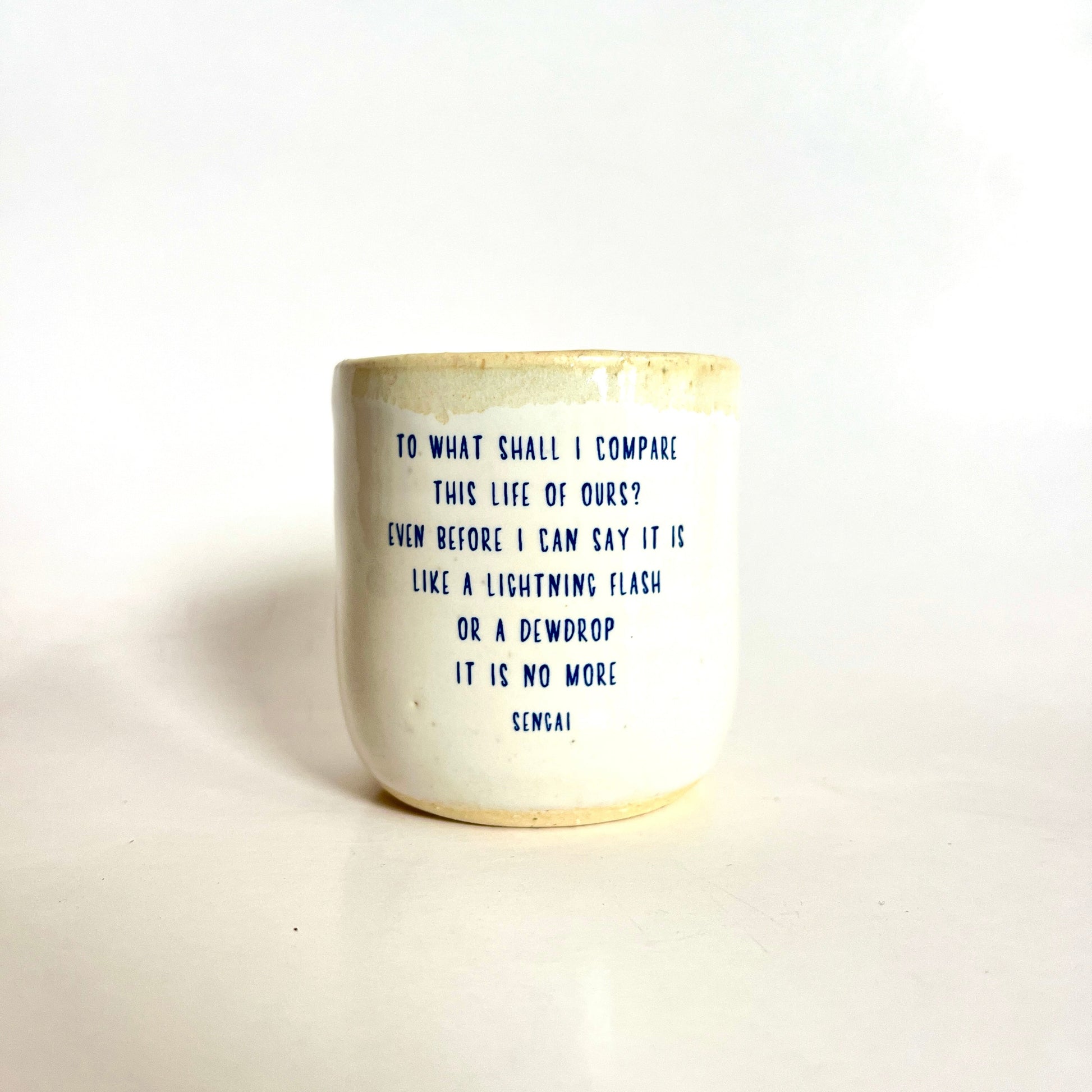 Ceramic mug with text on a white background